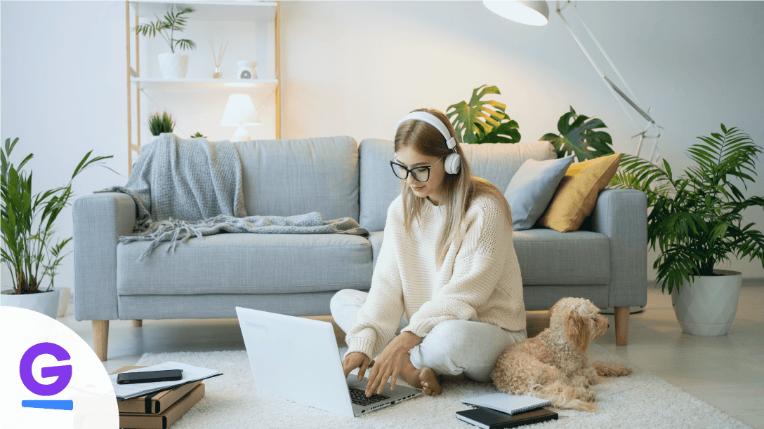 Programmer working remotely on laptop at home office desk